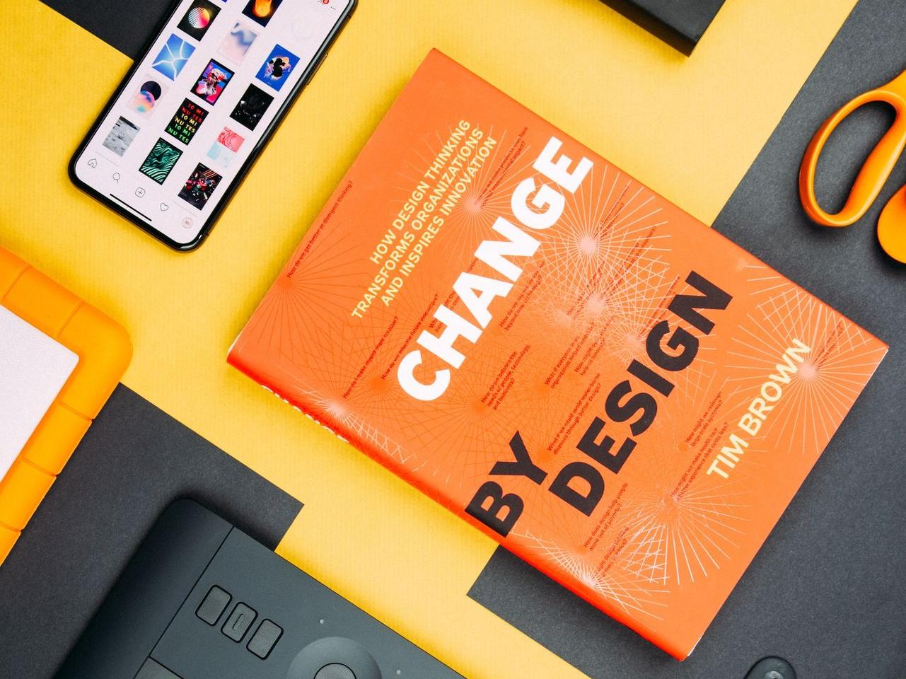 Change by Design by Tim Brown book beside smartphone